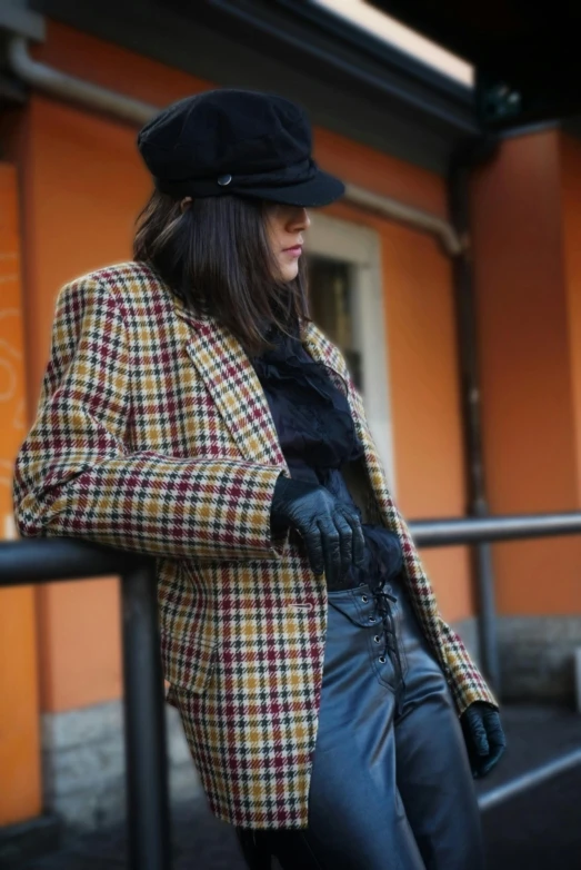 a person that is wearing a hat and a coat