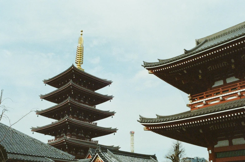 an architectural structure is seen against a cloudy sky