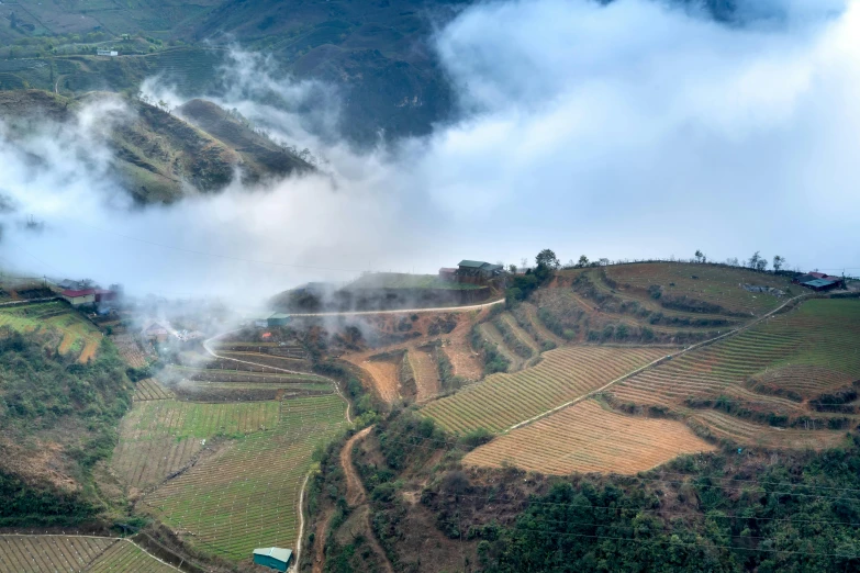 a view of a beautiful green hillside covered in mountains