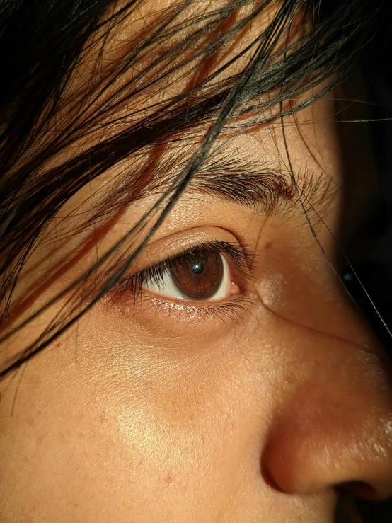 an image of closeup of a woman's eye