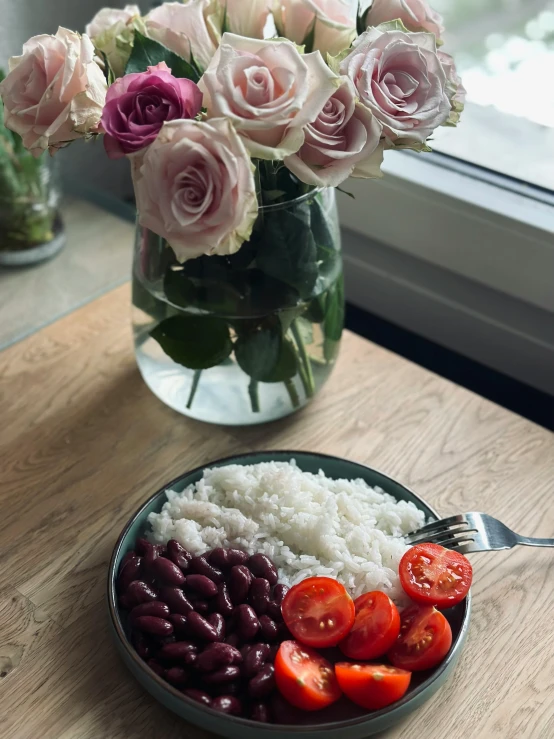 a close up of a plate with beans and rice