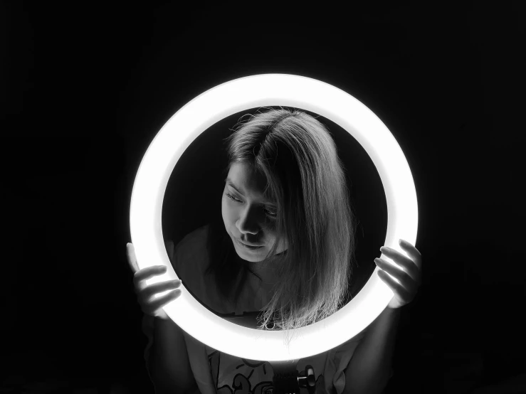 woman looking at herself through a mirror