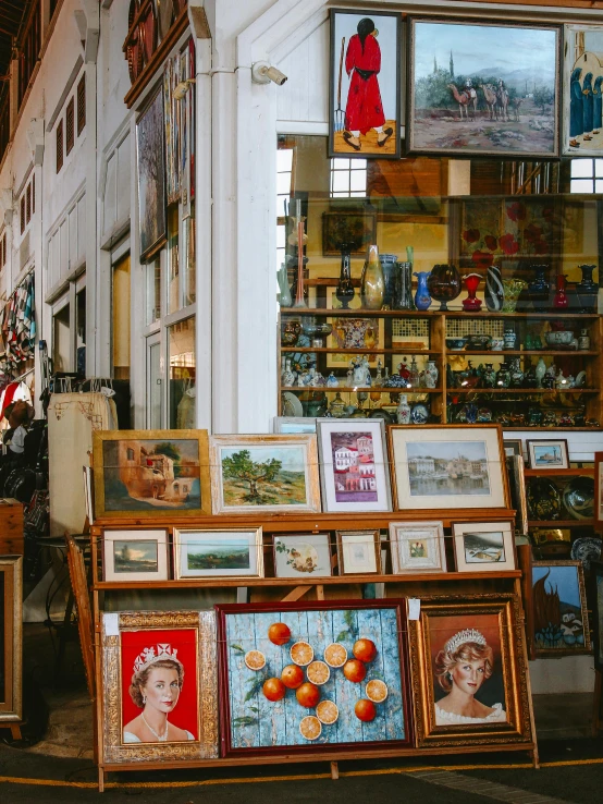 a store front that has different framed pos on it