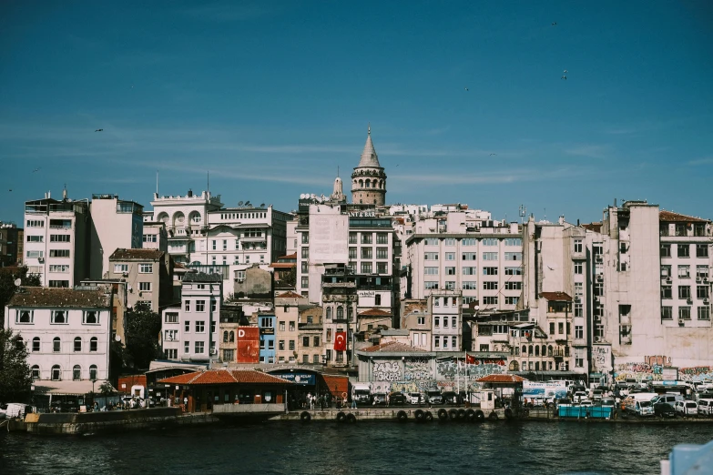 a city view on a river bank next to some buildings