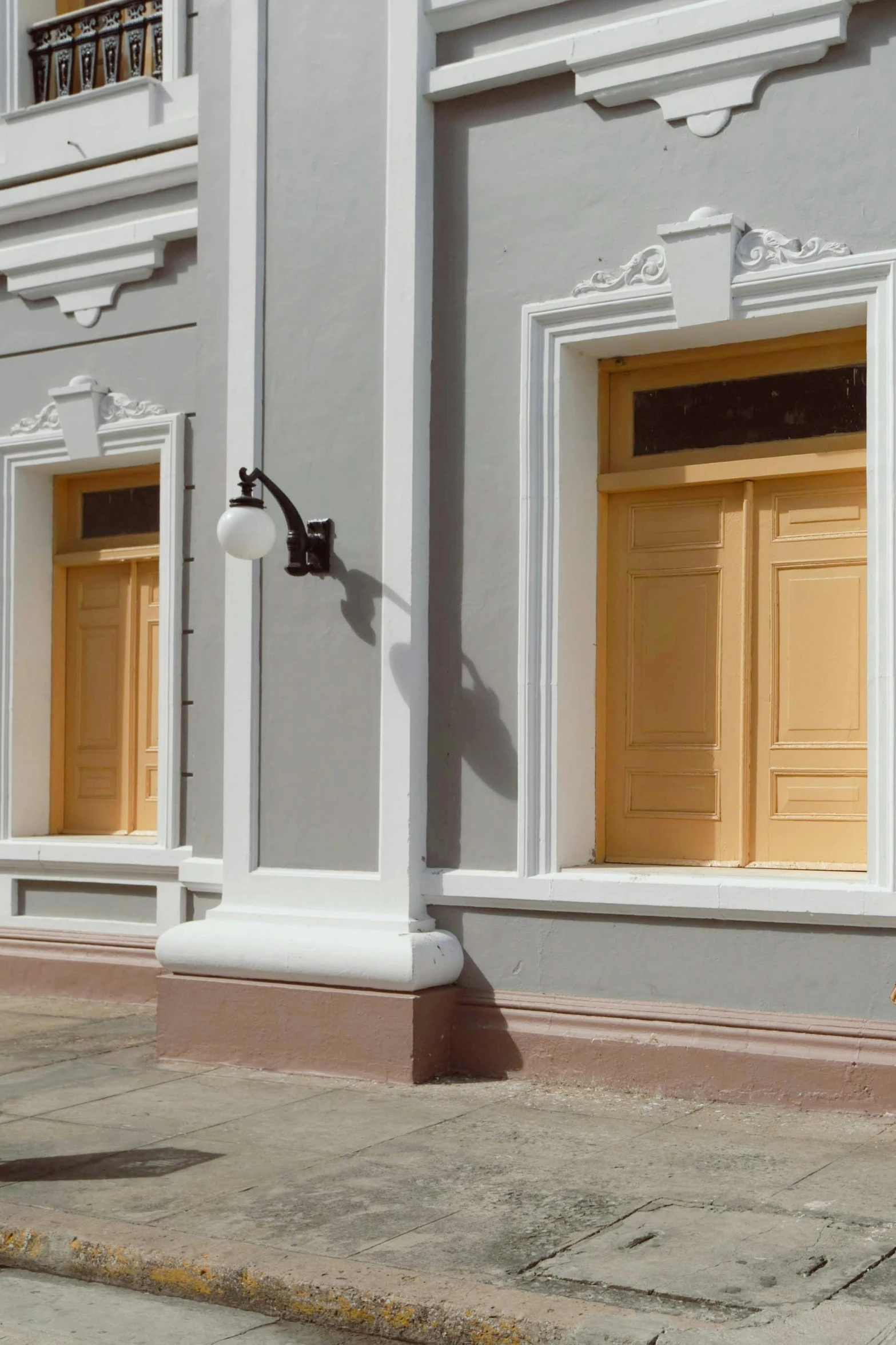 a yellow door sits on an old street corner