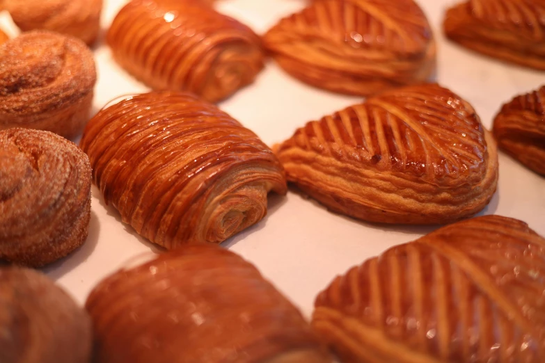 several pastry pieces are on display in a display case