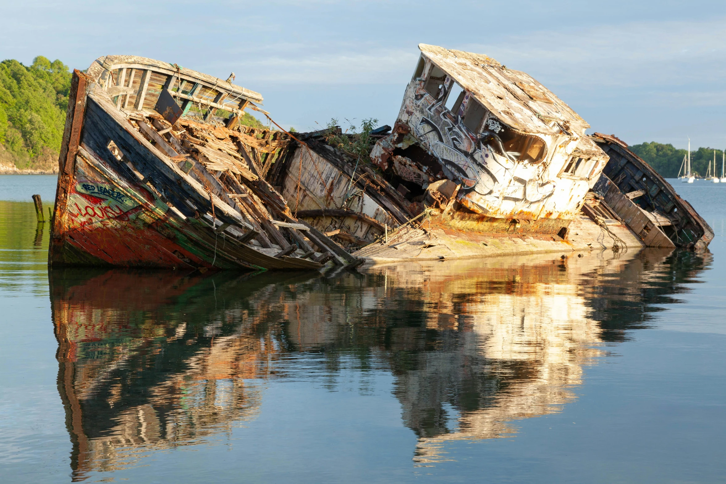 an old wrecked out boat on the water