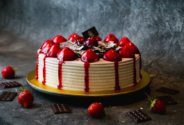 a chocolate cake with strawberries drizzled on top