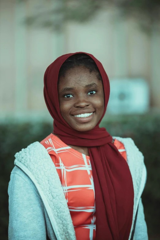 an african american woman smiles at the camera