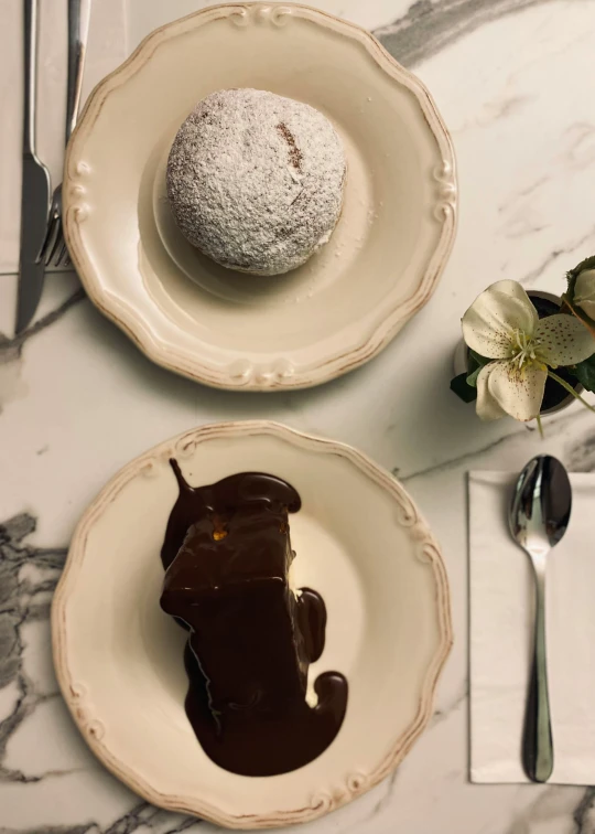 a dessert with a chocolate glaze and a sugar doll