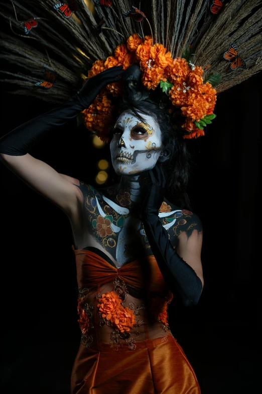 a woman in white face paint and feathers