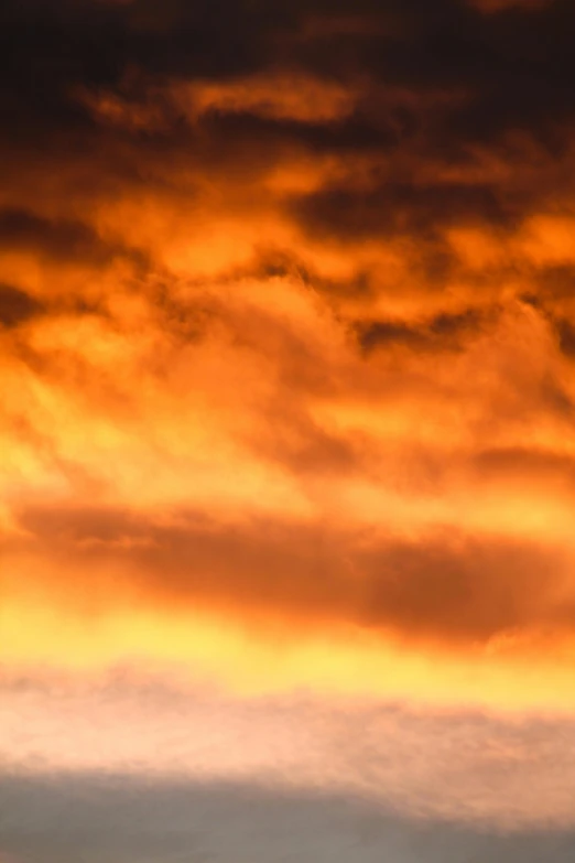 two people walking and flying an airplane at sunset