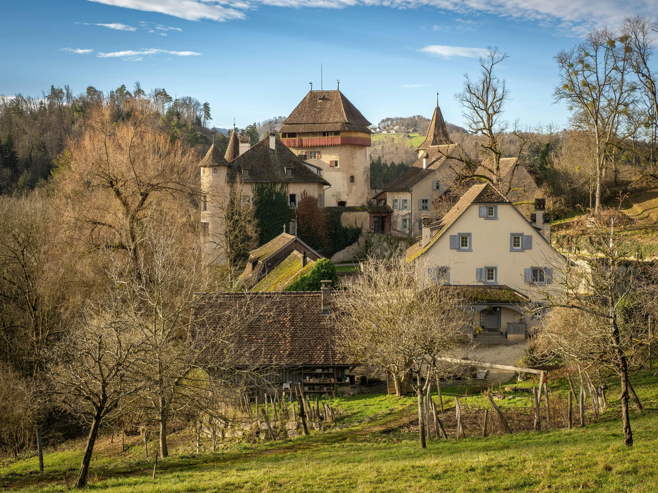 this is an old style house on a hill in a rural area