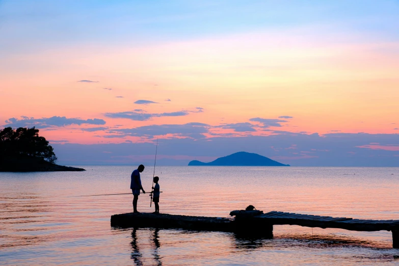 two people on a wooden raft in the water