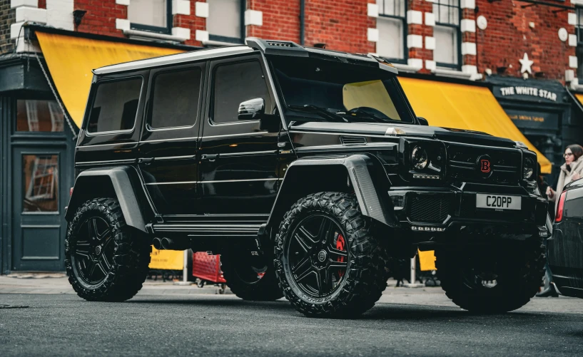 a mercedes benz benz benz g class is parked