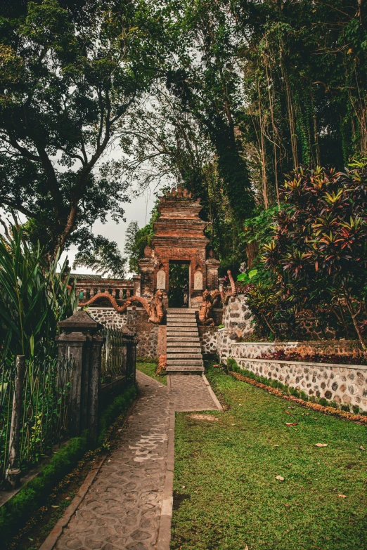 there is a garden that has steps leading to a small structure