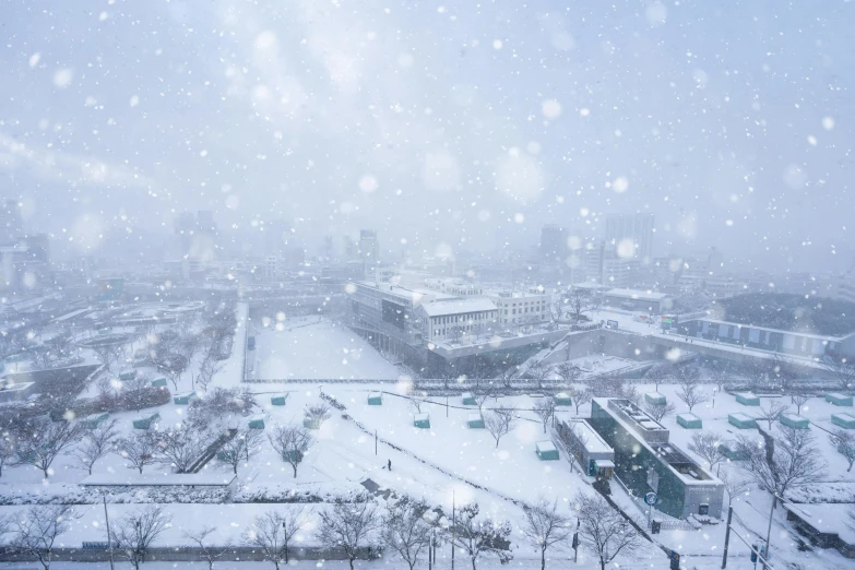 a snow - covered city is pictured on a cloudy day