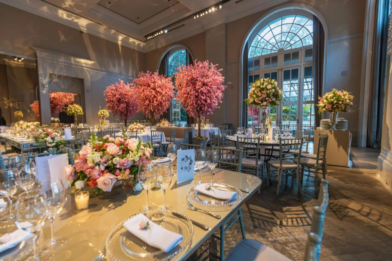 a very nicely decorated dinner hall with a table