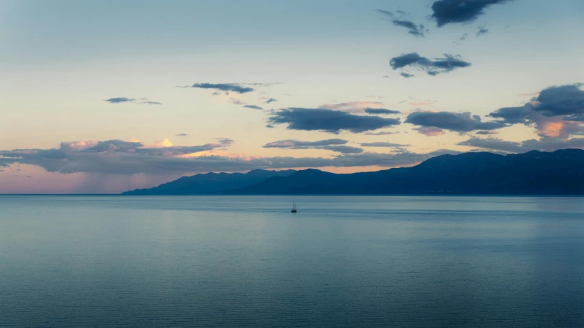 a person with a boat in a large body of water