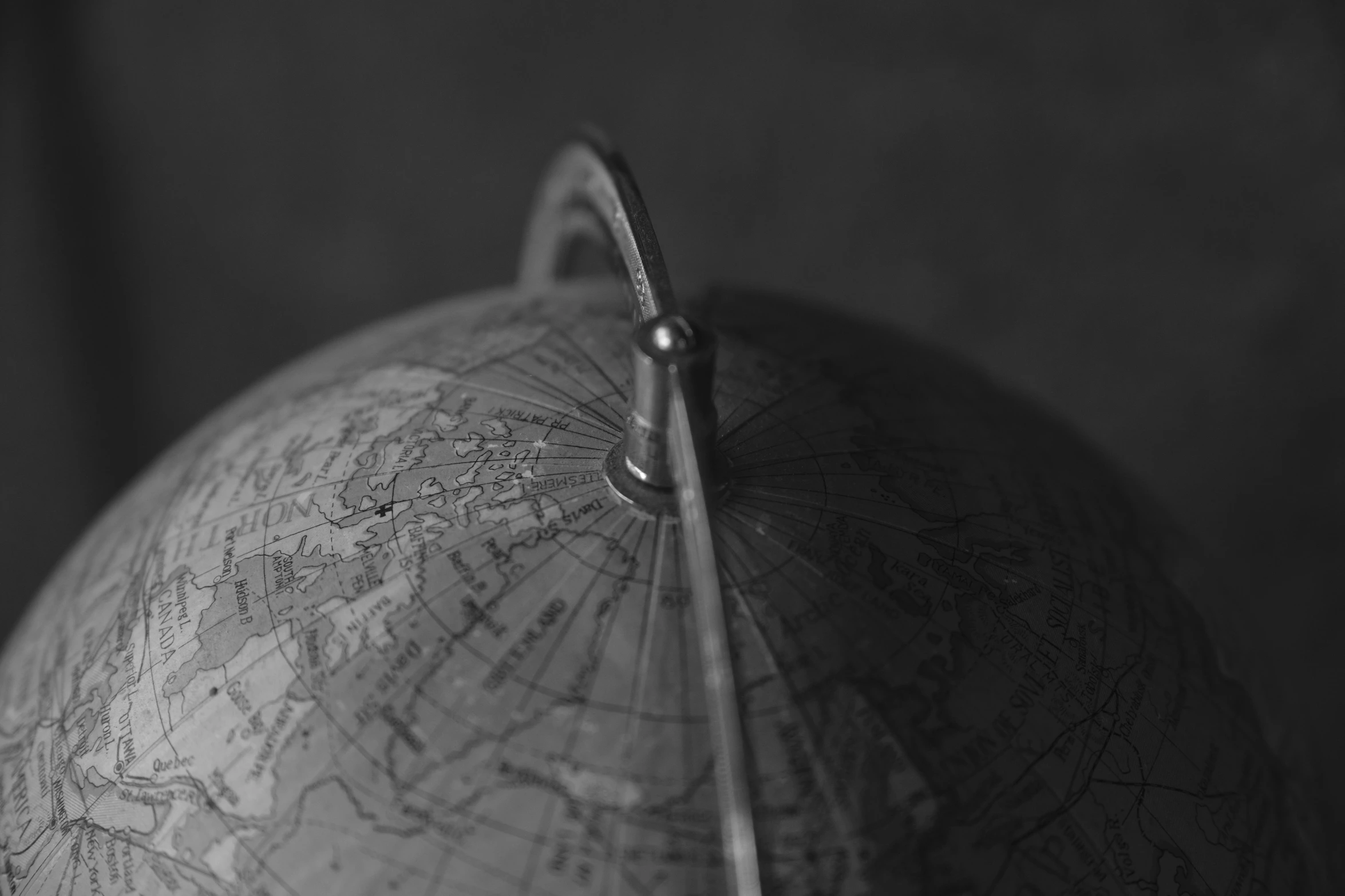 a large globe hanging on a hook in a room