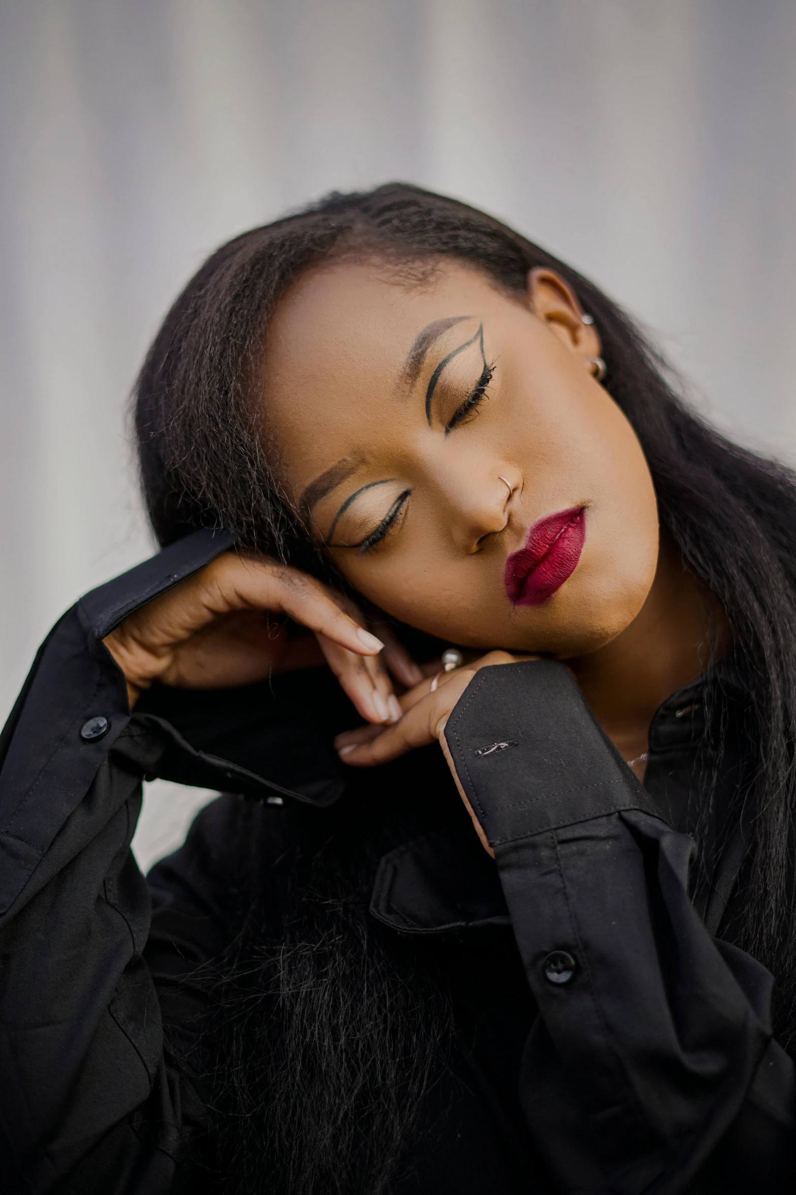 woman with long dark hair and red lipstick