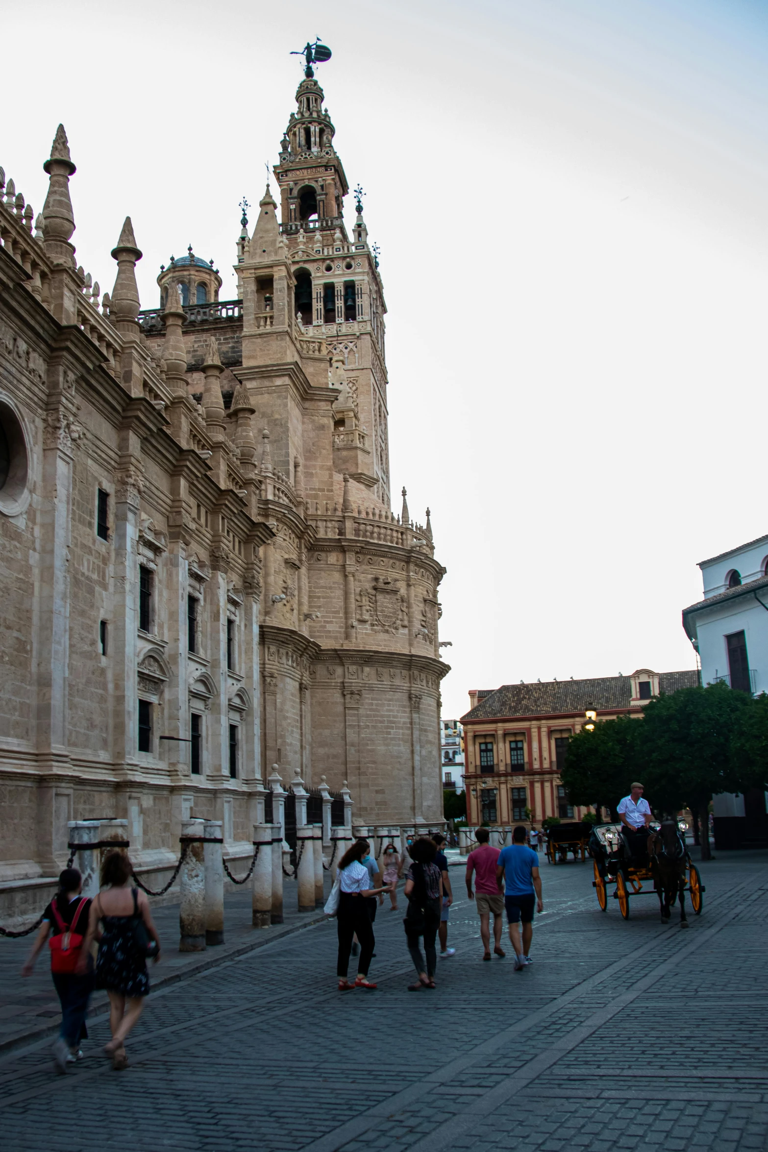 a group of people walking on the side walk