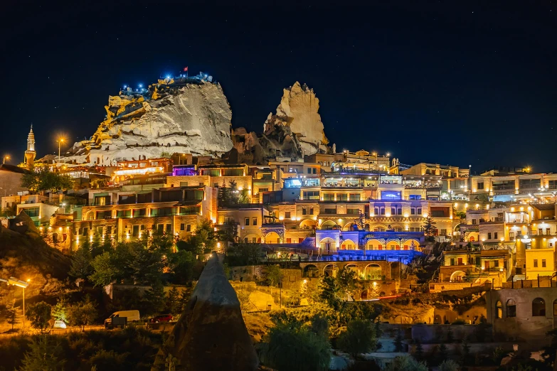 a night view of a city and the mountains