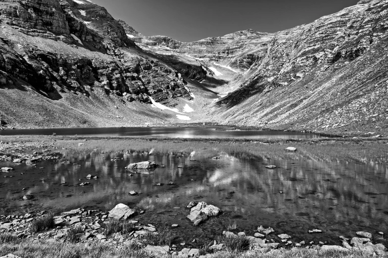 a small mountain lake surrounded by mountains