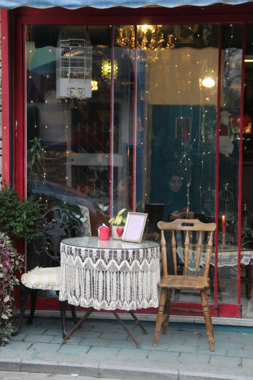 a table that has a glass back door with a small window on it