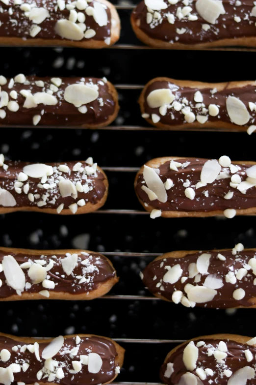 a cooling rack holds chocolate covered pastries