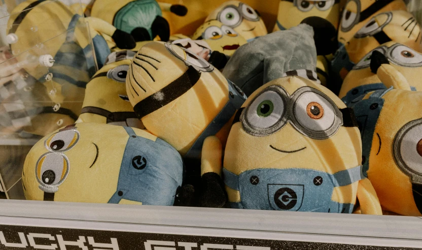 a bunch of stuffed minions from despicables sitting together