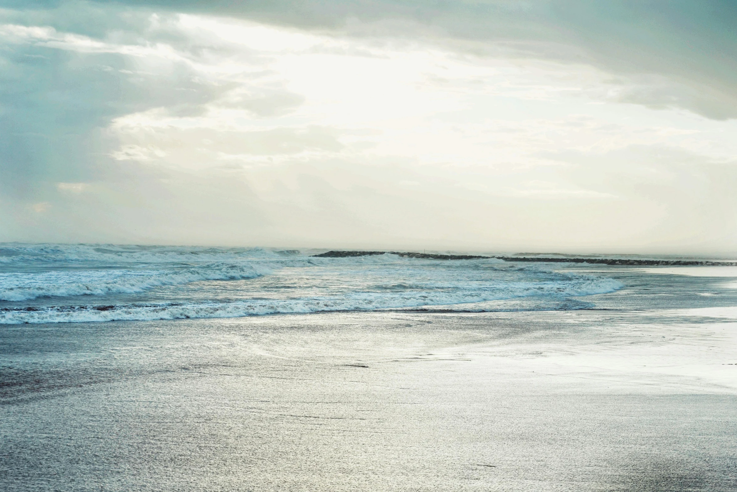 a couple of surf boards that are sitting in the sand