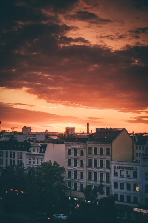 colorful sky and orange and red clouds with buildings