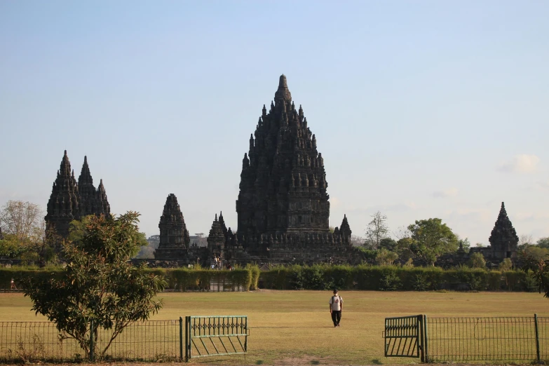 a person walking near a very large church