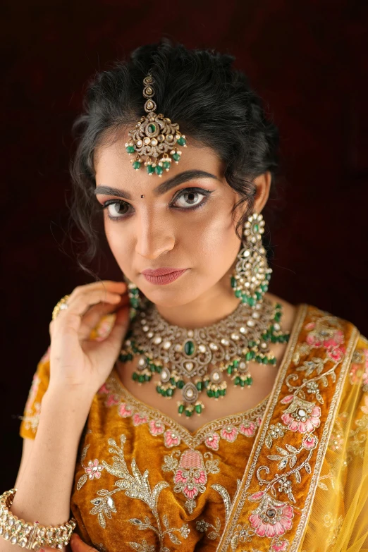 a young woman dressed in a saree