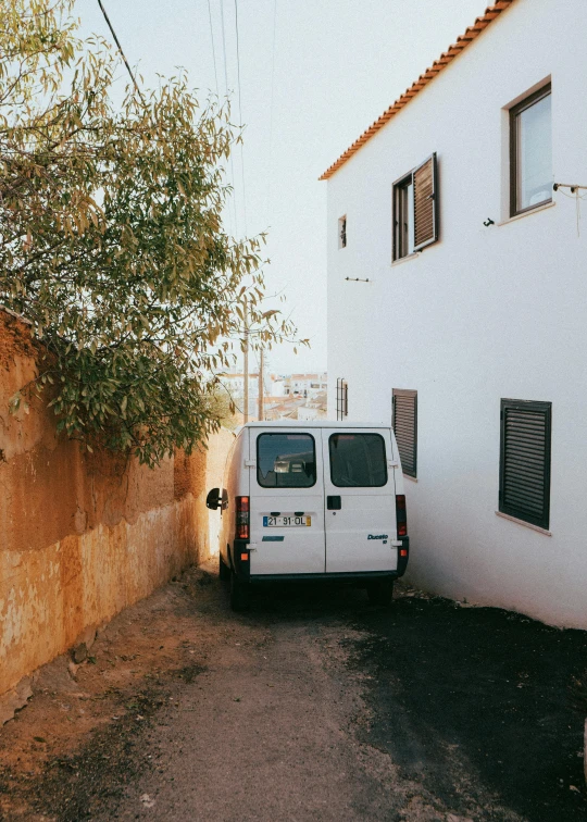 the van is parked in front of the house