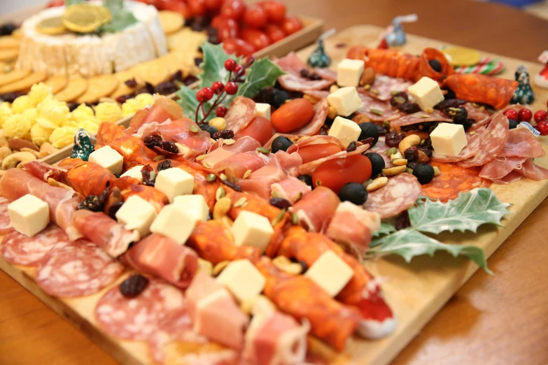 many types of meats on platters laid out