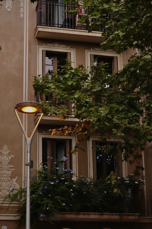 a lamp pole outside a large building