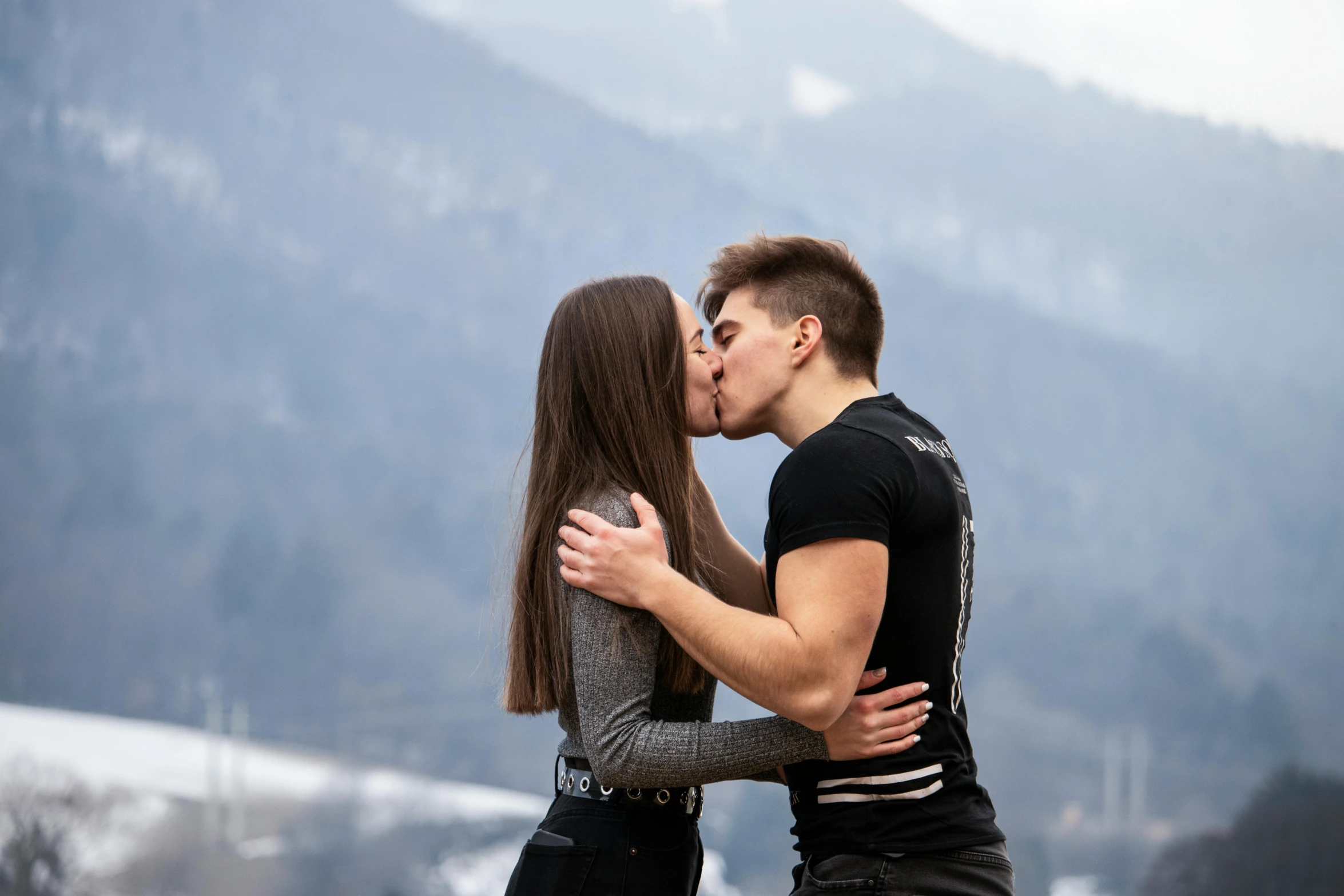 a woman and man that are standing next to each other