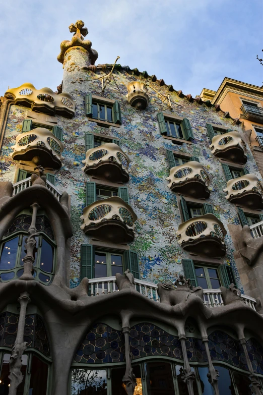 a tall building with multiple windows has ornate detailing