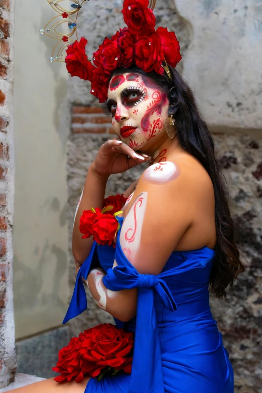 the young woman is wearing a skull mask