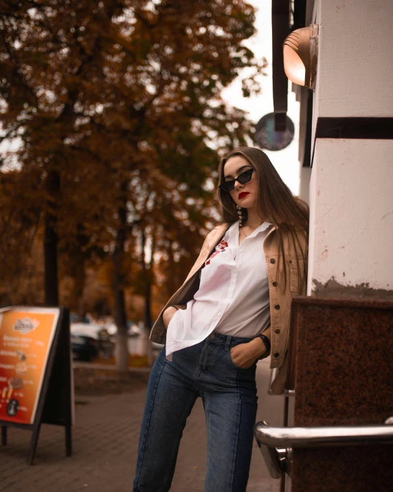 a woman with large  posing by a building