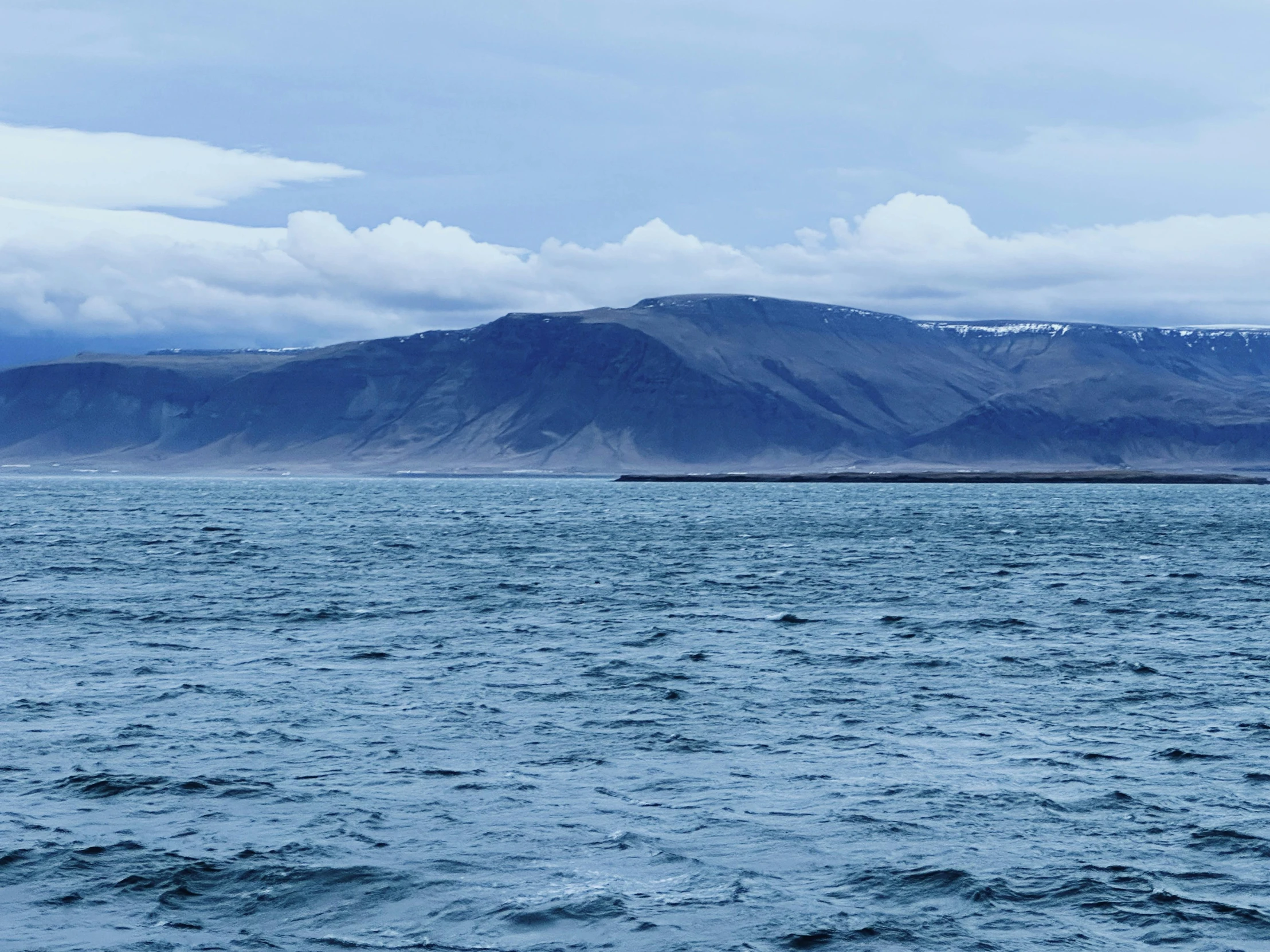 a sailboat in a large body of water