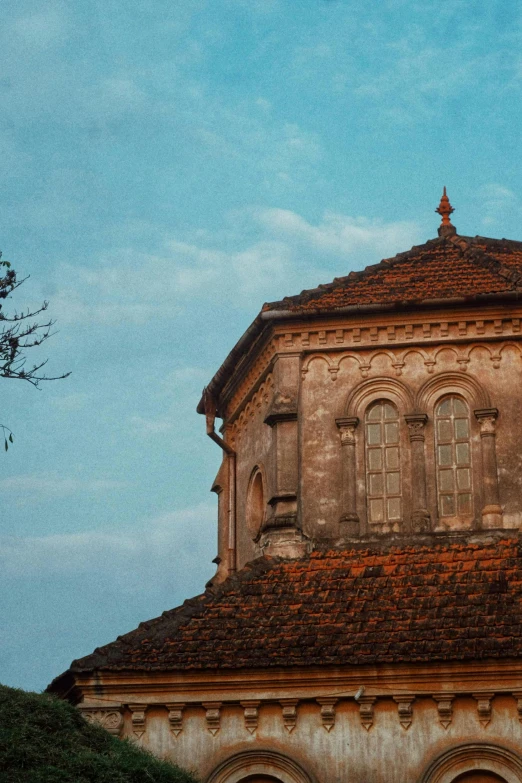 an old building is against the blue sky