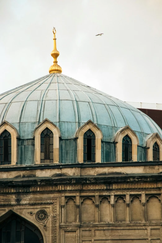 a large blue dome sits on the top of a church