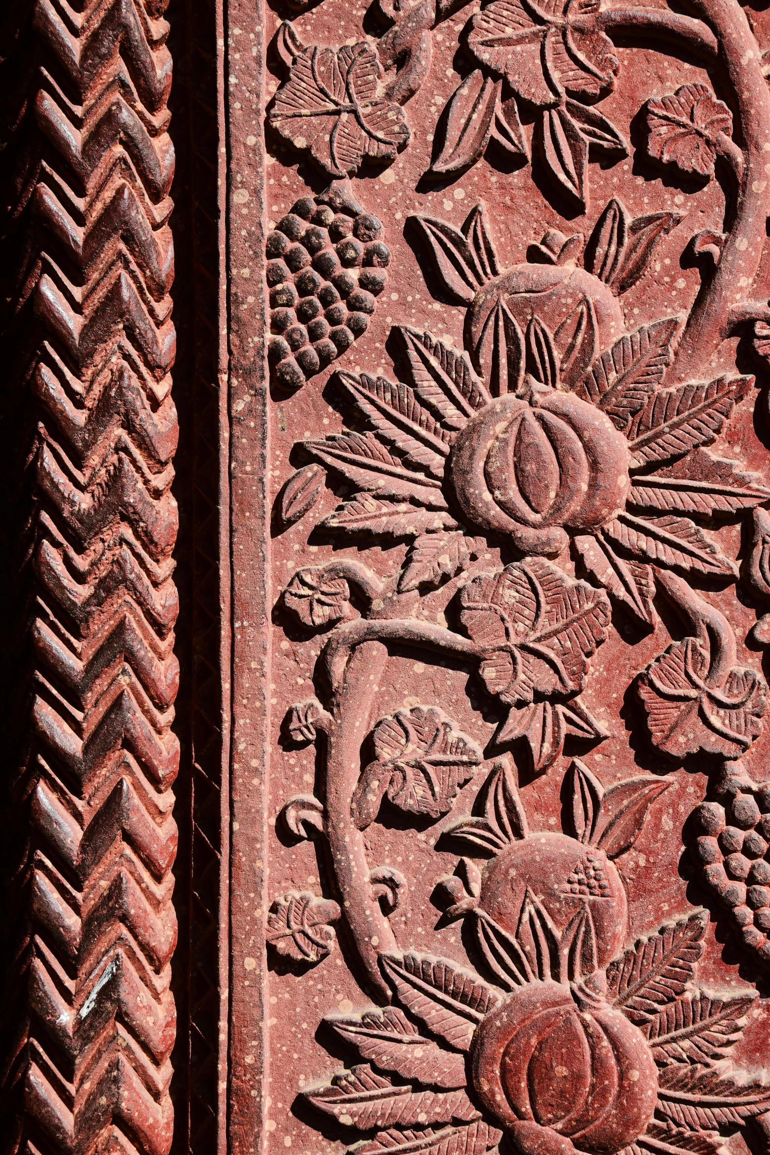 an intricately carved tile in a decorative style