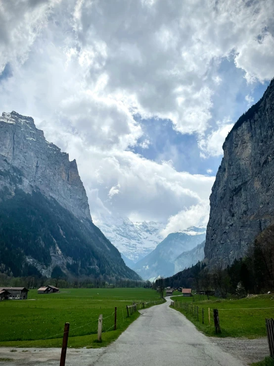 the path winds around a very scenic area with mountains in the background