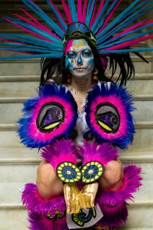 colorfully dressed woman in a costume and face paint