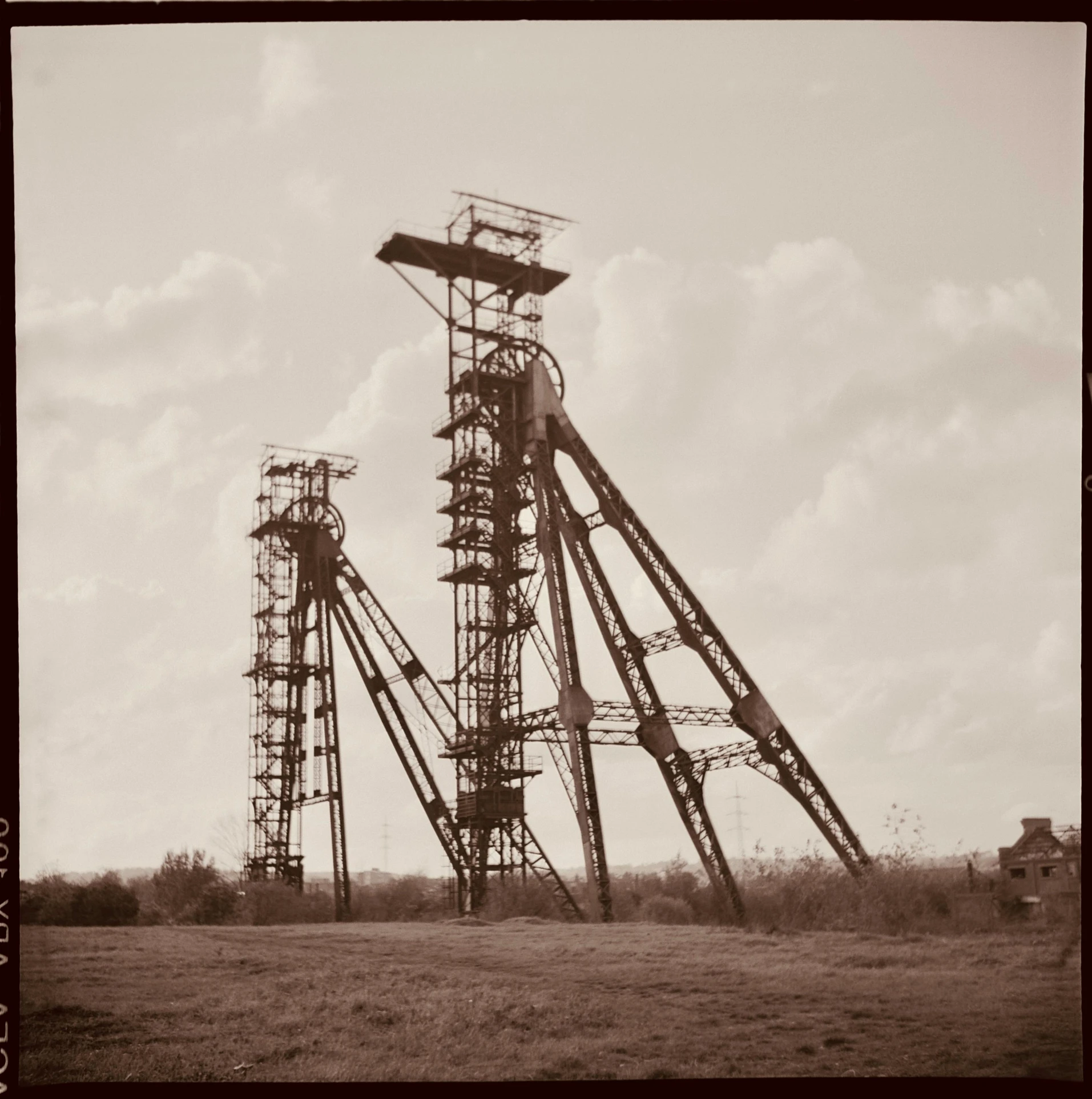 black and white po of a tower with metal support