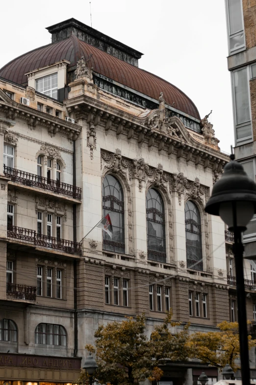 a tan building with some windows and balconies